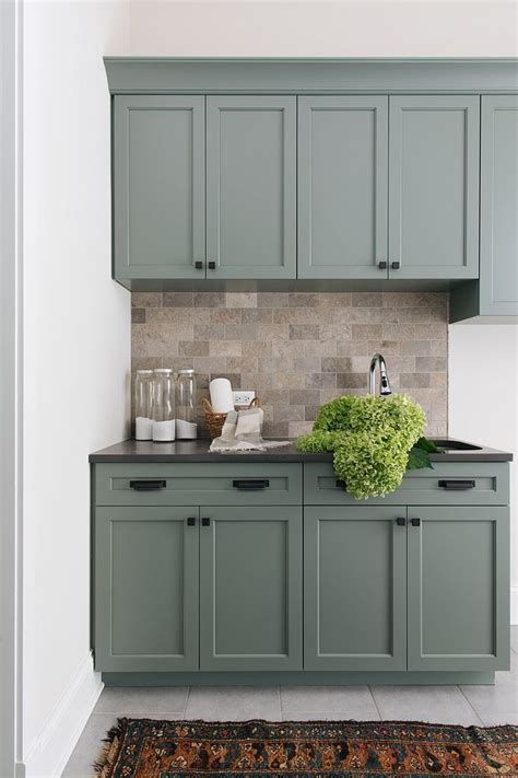 You can nod toward the current trend without having to paint all of the cabinets Sherwin Williams Gray Matters Kitchen Cabinets - Black Kitchen Ideas
