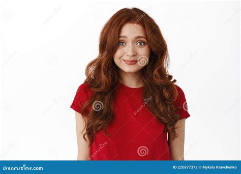 Close Up Of Shy Cute Ginger Girl Redhead Woman With Curly Hairstyle Smiling Modest And Looking