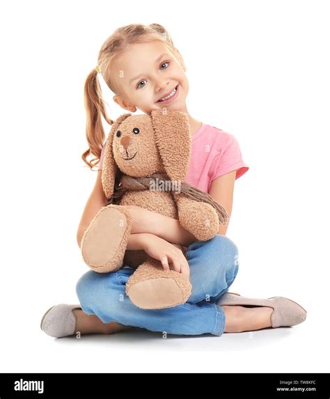 Cute Little Girl Holding Toy On White Background Stock Photo Alamy