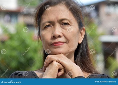 A Serious Filipina Female Senior Stock Image Image Of Coldhearted Minorities 157629385