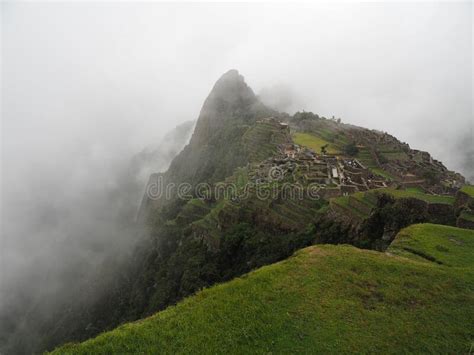 Gorgeous Shot Of The Machu Picchu Mountain In Peru In A Foggy Weather