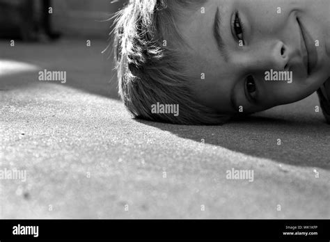 View Of Boy Lying Down Stock Photo Alamy