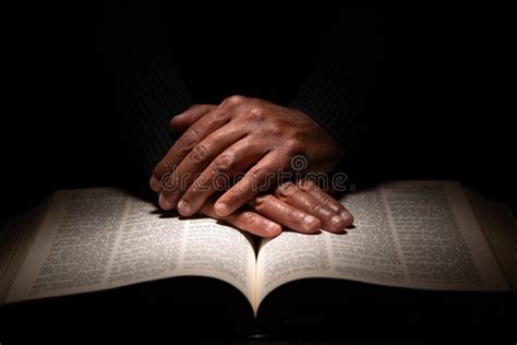 Praying Man Hands Holding And Clinching Old Bible Stock Photo Image