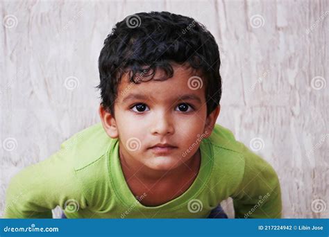 Three Year Old Indian Baby Boy In Close Up Looking With Green T Shirt