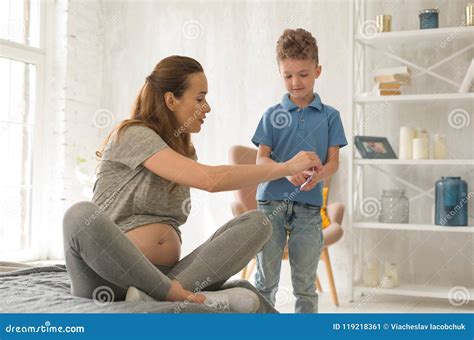 Caring Pregnant Mom Embracing Her Lovely Sons Royalty Free Stock Photo
