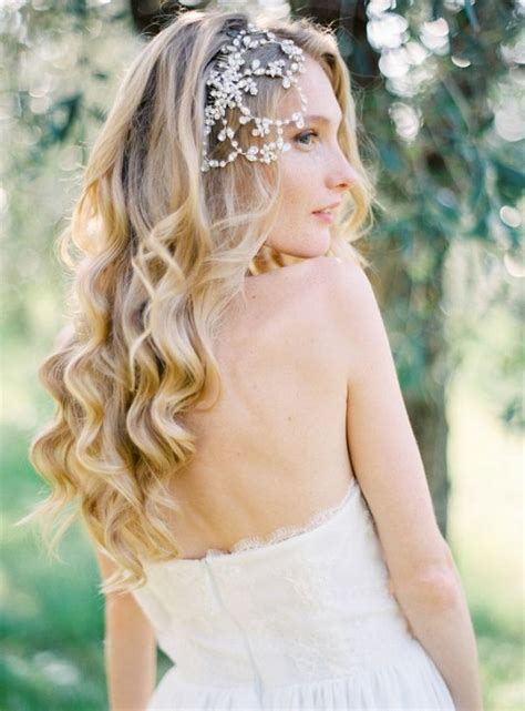 If you want to wear your hair down, you can just pull a part of your hair off your face and use wedding hair accessories such as wedding hairstyles tutorial: long wavy down wedding hairstyle with jeweled bridal hair ...