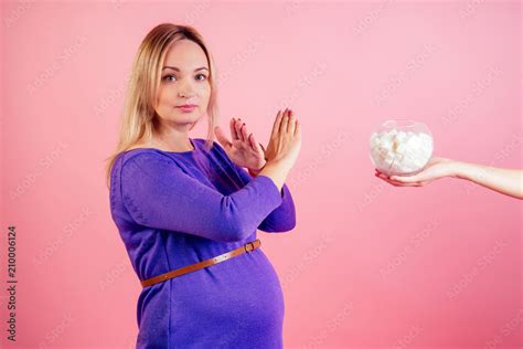 Beautiful Blonde Pregnant Woman In A Violet Dress With Big Baby Bump