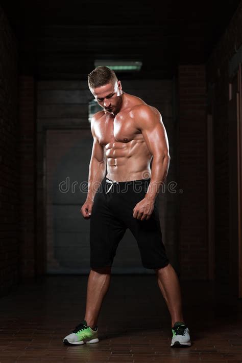 Young Man Flexing Muscles Stock Photo Image Of Exercises 85170992