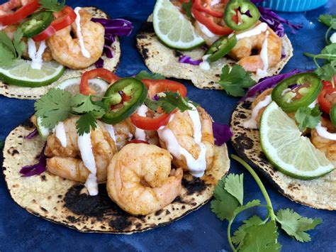 With the exclusion of the sliced black olives on top, plus a few other minor changes, this recipe copies the new formulation of the chain's enchilada/burrito fusion product first introduced in the early 60s. Spicy Shrimp Tacos - The Preppy Hostess | Spicy shrimp ...