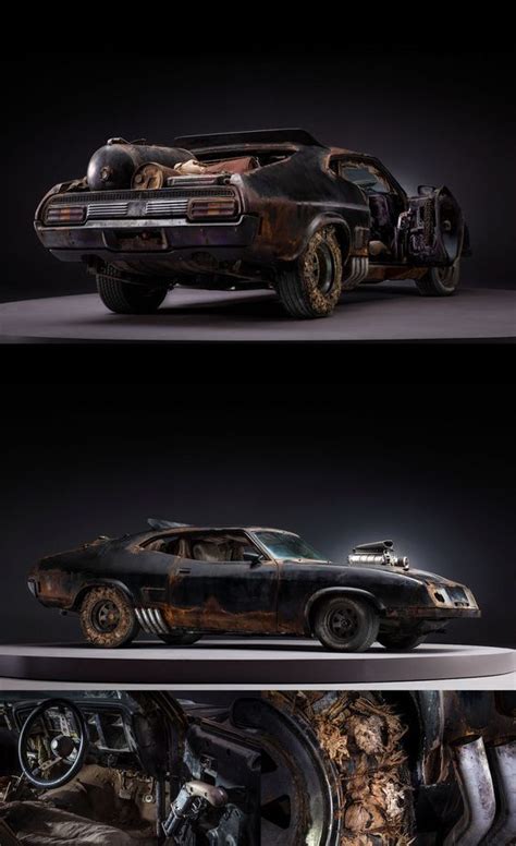 An Old Car That Has Been Turned Into A Sculpture