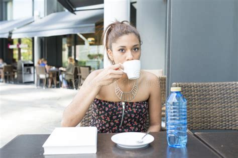 Beautiful Woman Drinking Coffee In The Terrace Restaurant Stock Image