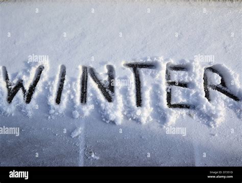 The Word Winter Is Written In The Cold Snow Stock Photo Alamy