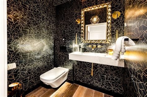 Elegant Bathroom Featuring A Mid Century Modern Black And Gold Wall