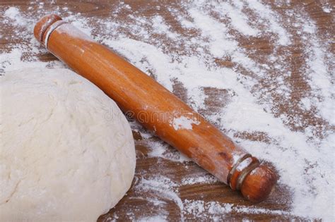 Round The Dough And Rolling Pin On Floured Table Stock Image Image Of