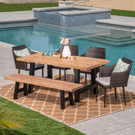 Outdoor 6 Piece Wicker Dining Set With Light Weight Concrete Table And Bench And Cushions