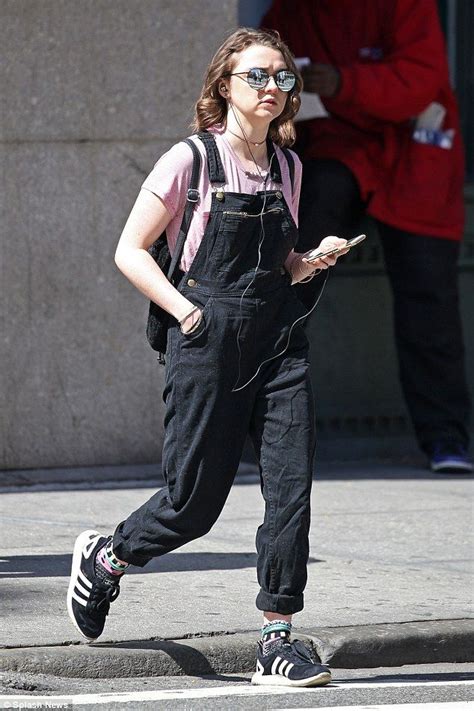 Maisie Williams Rocks Denim Overalls With Pink T Shirt And Trainers