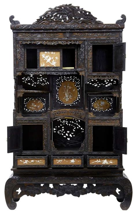 The main difference between the two is that china cabinets usually only have glass panels in front to display your dishes and fine dining ware, whereas curio cabinets have glass on multiple sides so you can show off a prized collection or various knickknacks. Early 20th Century Shibayama Japanese Carved Decorative ...