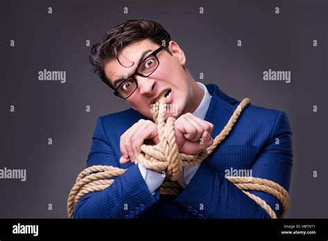 Businessman Tied Up With Rope Stock Photo Alamy