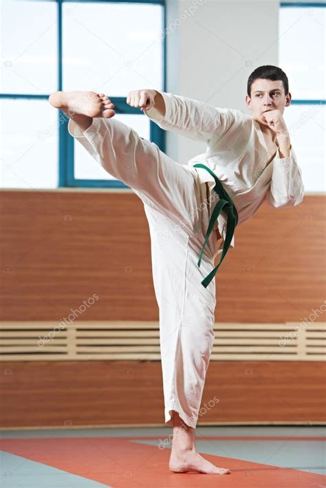 Man At Taekwondo Exercises Stock Photo By ©kalinovsky 18869713