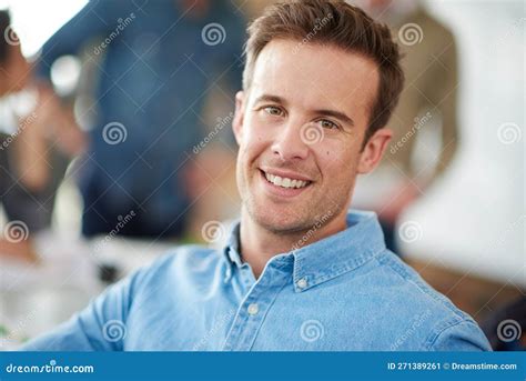Hes a Cut Above the Rest. a Handsome Young Man Sitting in a Meeting