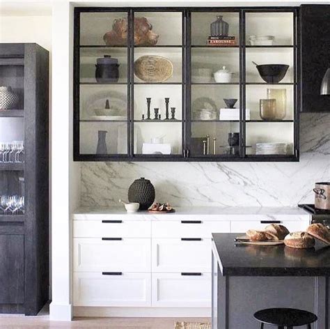 Now white with new hardware, the kitchen cabinets brighten up the room. Pin by Heather B. Armstrong on Kitchen Ideas | Kitchen interior, Kitchen design, Glass kitchen ...