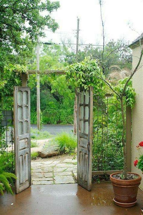 Old Doors Repurposed As Entrance Gate To A Yard Garden