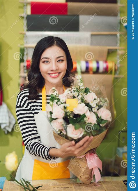 Florist Shop In Daylight Woman Holding Beautiful Bouquet Of Flowers