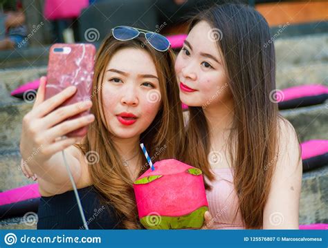 Lifestyle Outdoors Portrait Of Young Happy And Beautiful Asian Chinese