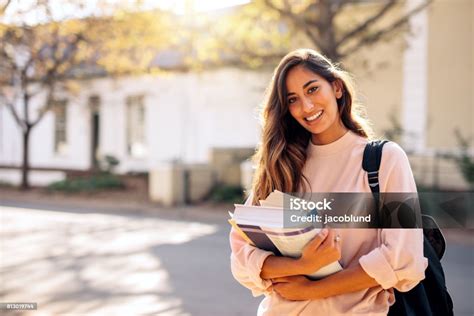 Female College Student With Books Outdoors Stock Photo Download Image