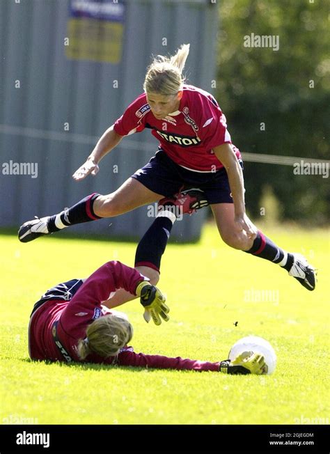 norway s dagny mellgren top receives a kick between her legs from goalkeeper silje