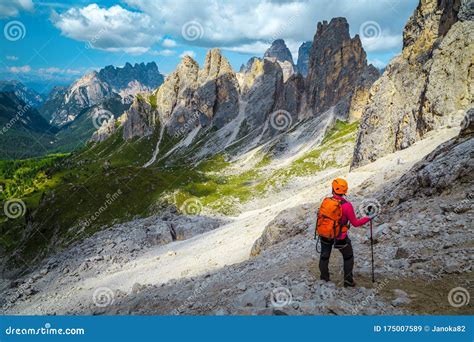Woman Hiker With Backpack On The Hiking Trail Dolomites Italy Stock