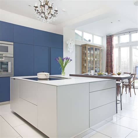 Soften things up with a matt, duck egg blue kitchen. Navy kitchen with contrasting grey island | Navy kitchen ...