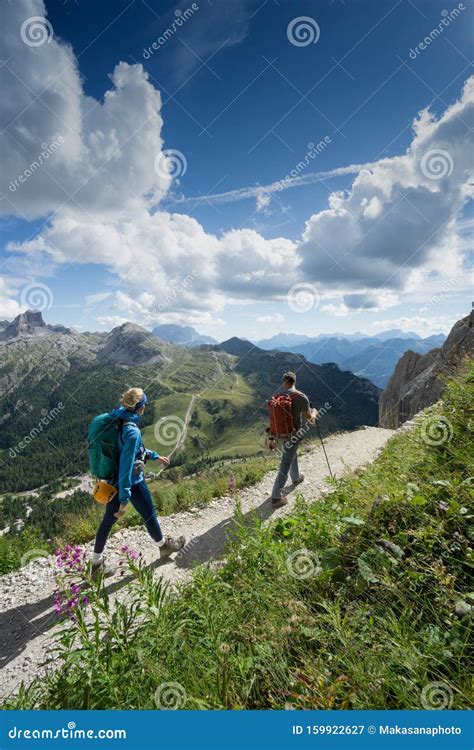 Mountain Guide And Blonde Woman Client Returning From A Climb In The
