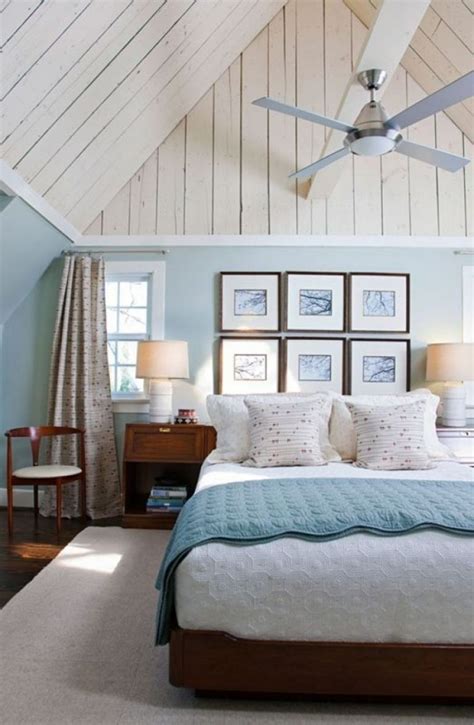 Large primary bedroom featuring light blue walls and a stunning ceiling, along with reddish hardwood flooring topped by a classy rug. 15 Amazing Coastal Bedroom Decorating Ideas For ...