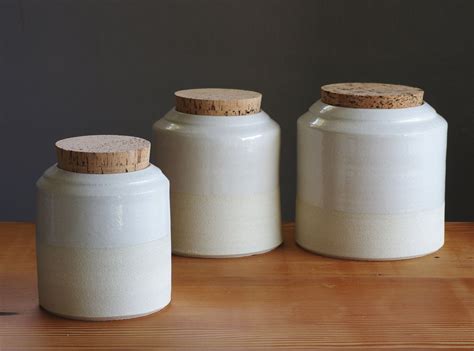 Many are designed for hot and cold liquids. 3 piece canister set - off white stoneware with gloss ...