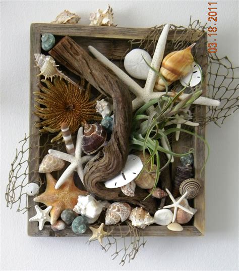 Having a nautical theme party? Wall box made from a barnwood frame. Then hot glued on ...
