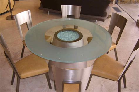 It stands atop a metal base with a polished chrome finish, taking on. Crystalline Sphere Glass Dining Tables Sans Soucie