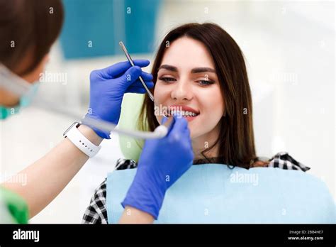 Dentist Drilling Tooth Young Patient Hi Res Stock Photography And