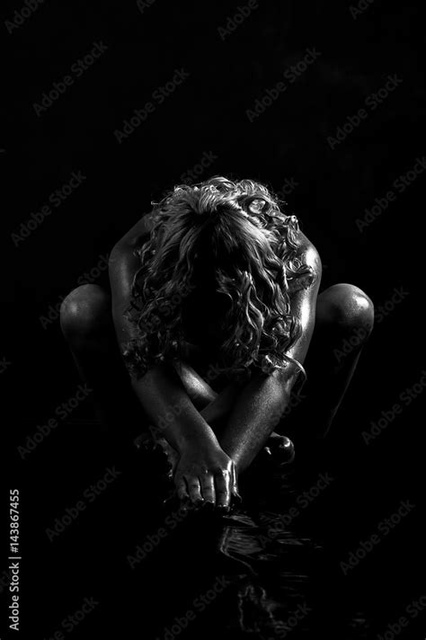 Beautiful Sexy Naked Kinky Blonde Female Sitting On The Floor In The Darkness She Stretching