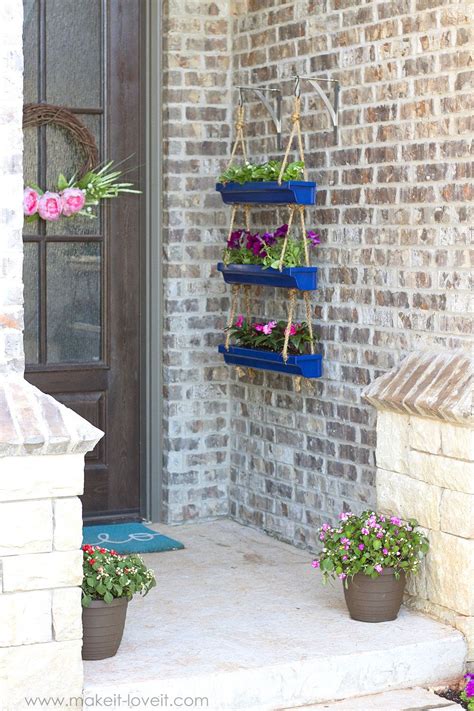 The downspout is the metal or plastic tube running from your roof's gutters to the ground. DIY Hanging Rain Gutter Planters | Make It and Love It in 2020 | Porch planters, Diy garden ...