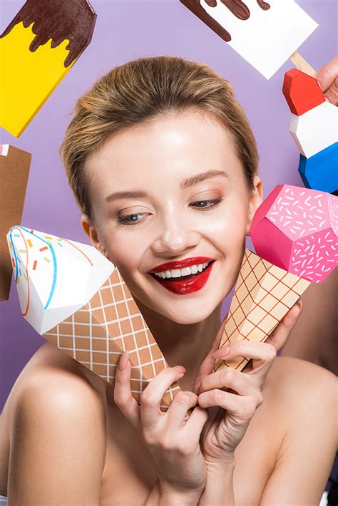 Cheerful Naked Woman Holding Decorative Ice Cream Cones Isolated On Purple