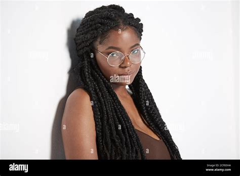 Young African American Female With Braids In Stylish Round Glasses