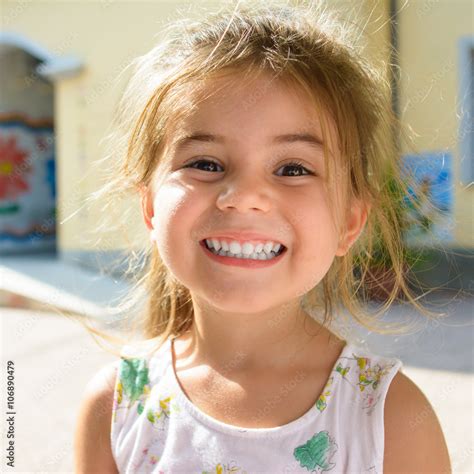Cute And Young Little Girl Smiling Stock Photo Adobe Stock