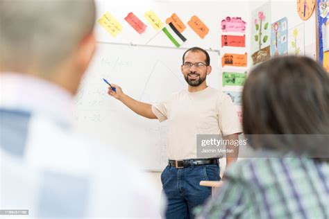 Teacher Explaining Lesson To Students High Res Stock Photo Getty Images