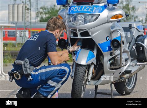 German Police Officer Is Cleaning His Bmw Police Patrol Motorbike