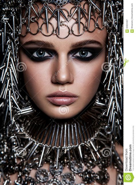 High Fashion Beauty Model With Metallic Headwear And Dark