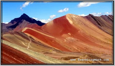Photo Rugged Red Valley With Slope Of Rainbow Mountain In Bottom Left