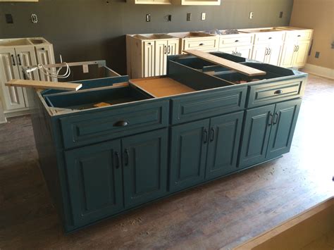 I cannot tell you how much i am itching to start work on the lakehouse, but the townhouse sale has hit a few snags and my work takes precedence. Kitchen island, turquoise paint | Custom cabinets ...