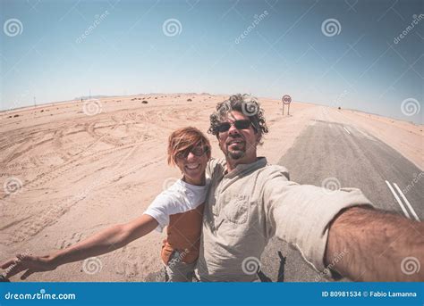 Adult Couple Taking Selfie On Road In The Namib Desert Namib Naukluft