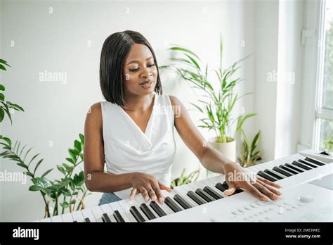 Young Woman Playing The Piano Hi Res Stock Photography And Images Alamy